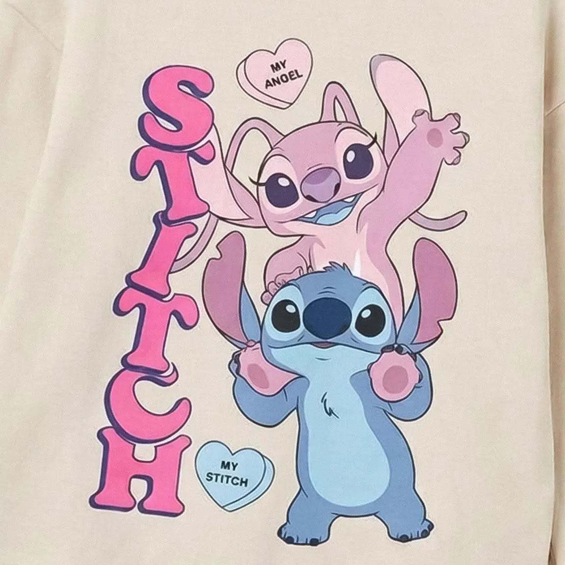 Detail print met Stitch, Angel en hartjes