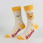 Geel met wit geblokte Poeh sokken met bijtje en Winnie tekst