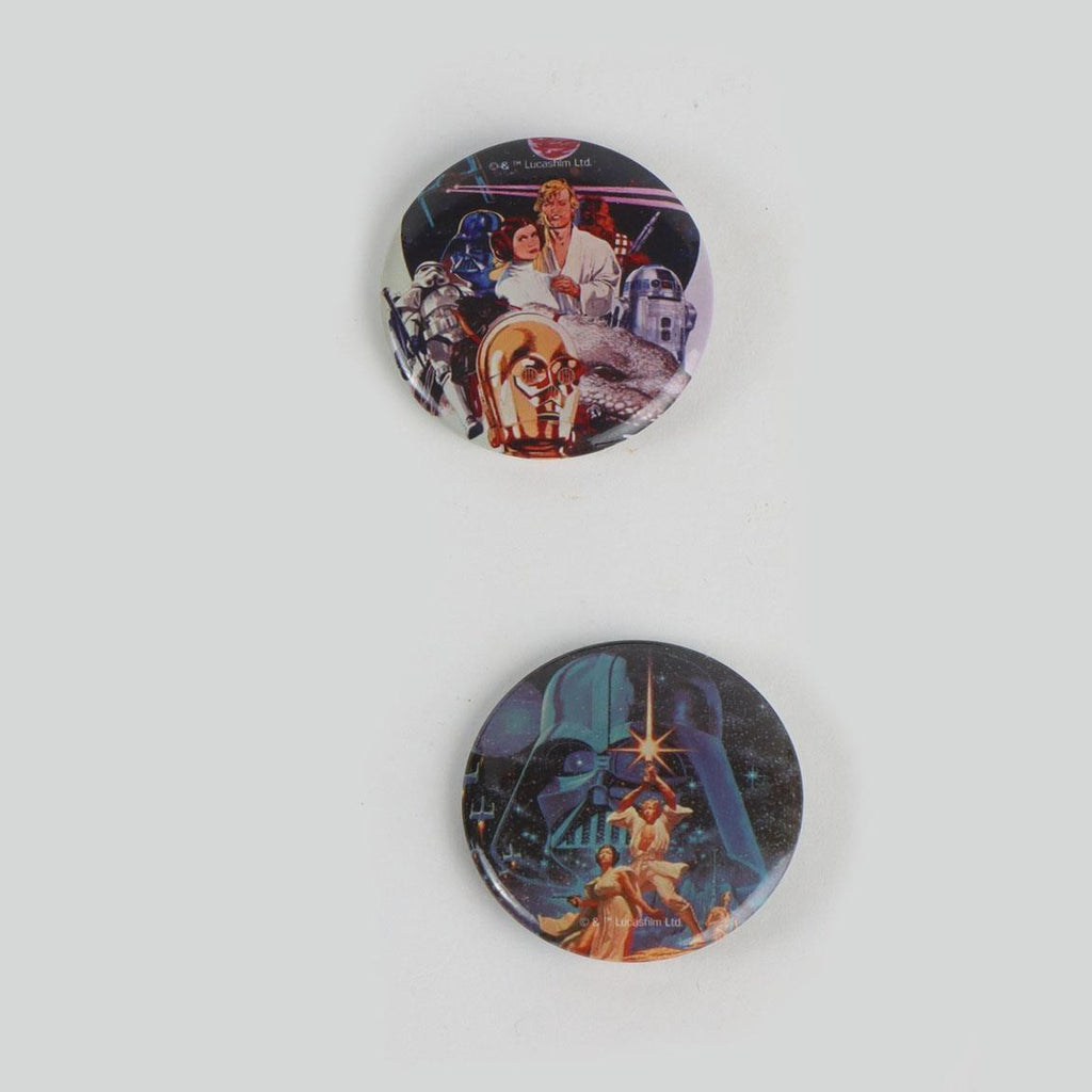 Twee buttons met klassieke Star Wars filmposters